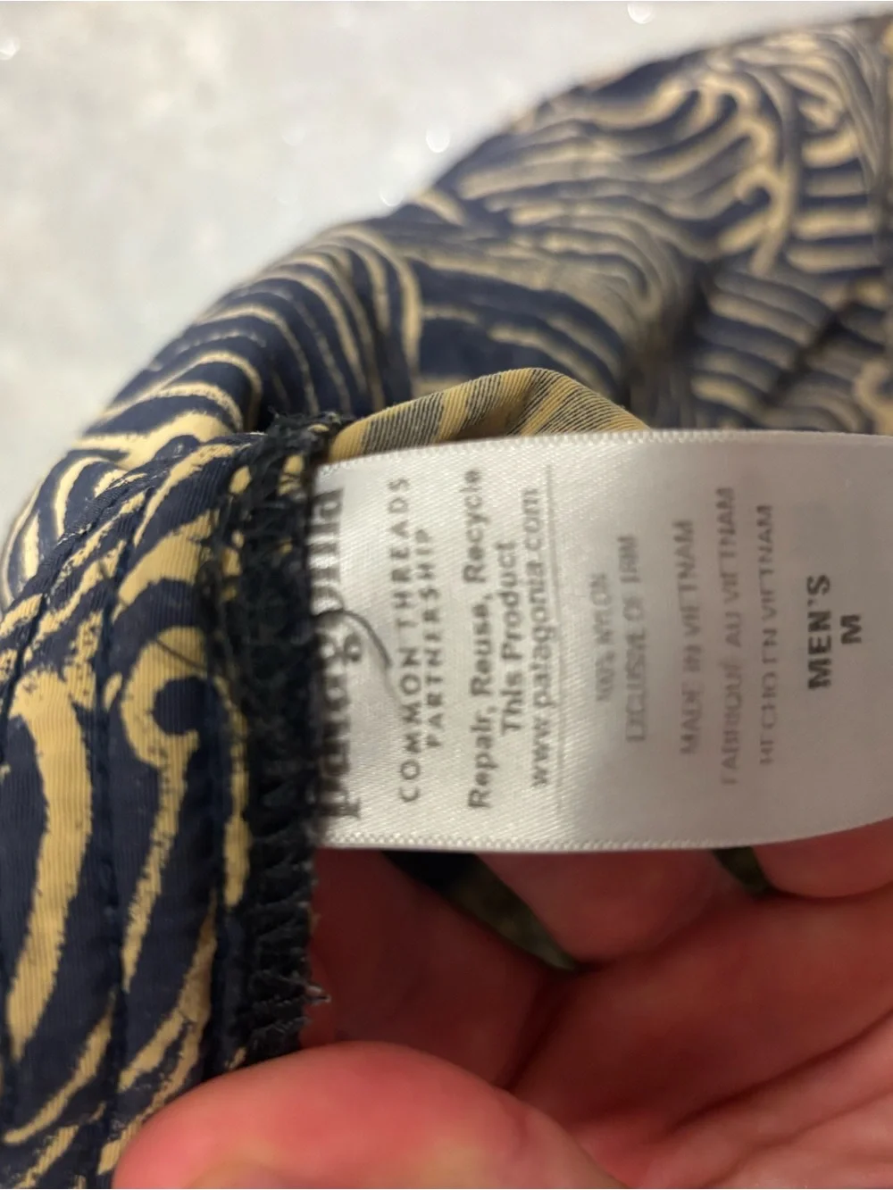Patagonia x Common Threads Baggies Navy and Tan Wave-Print